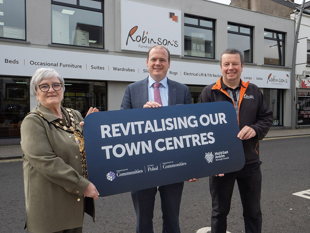 Mayor of Mid and East Antrim, Alderman Beth Adger MBE and Communities Minister, Gordon Lyons MLA with Michael Robinson from Robinson’s Furniture Store in Larne who benefited from new signage as a result of the first phase of the Town Centre Shop Front R